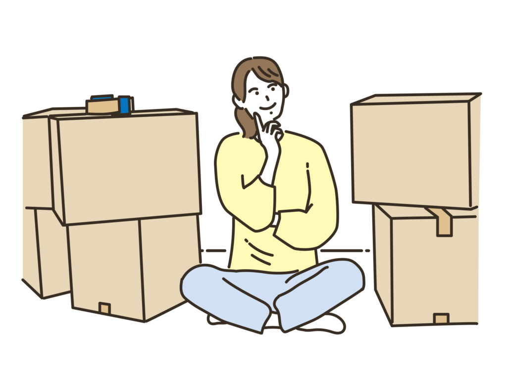 段ボールに囲まれて座る人のイラスト